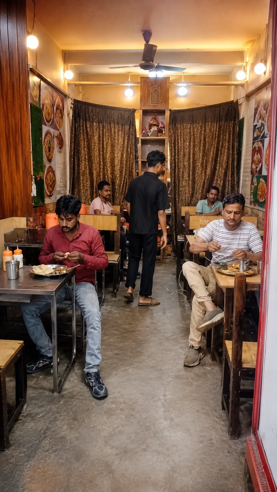 Customers enjoying food inside Ganga Ram Bhature Wale